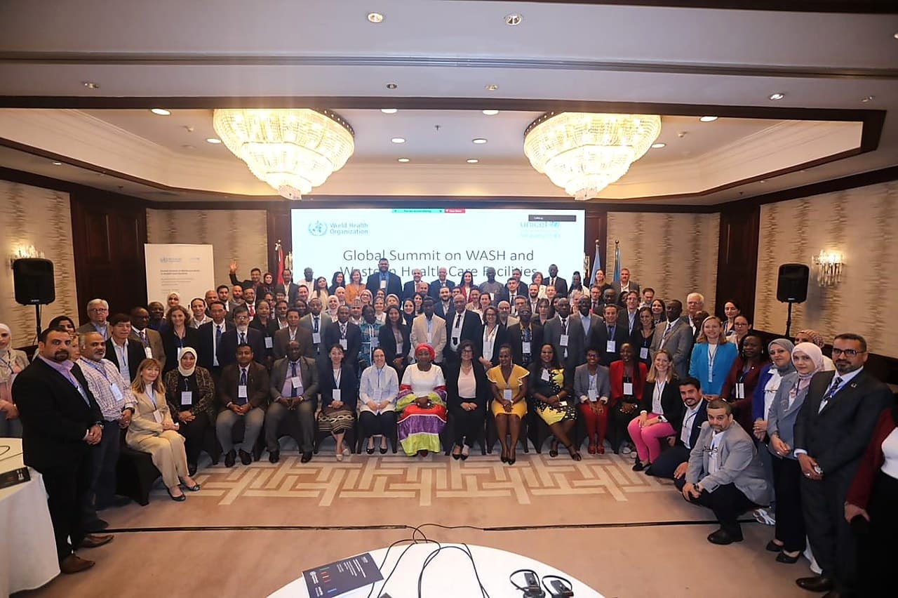 A large delegate group photograph at the Global Summit on WASH in Health Care Facilities.